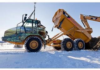 Съчленени самосвали Caterpillar 730